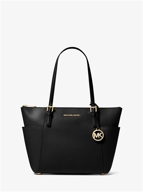 michael kors small jet set tote black &|Michael Kors bag with airplanes.